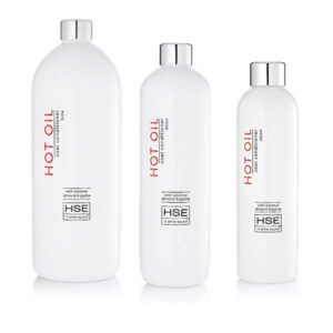 Three bottles of HSE Hot Oil Coat Conditioner on a white background.