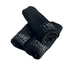 Three black towels with the word HSE CoolGroom Hi-Performance Sport Towel on them.