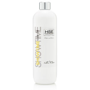 A bottle of HSE Showtime Coat Oil with creamy sunflower and jojoba. The HSE Hot Oil infused serum comes in a white bottle adorned with black, yellow, and gray text, capped off with a sleek silver cap.