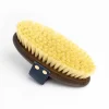 An NTR Embrace Sisal Brush with yellow bristles and a black strap is shown against a white background.